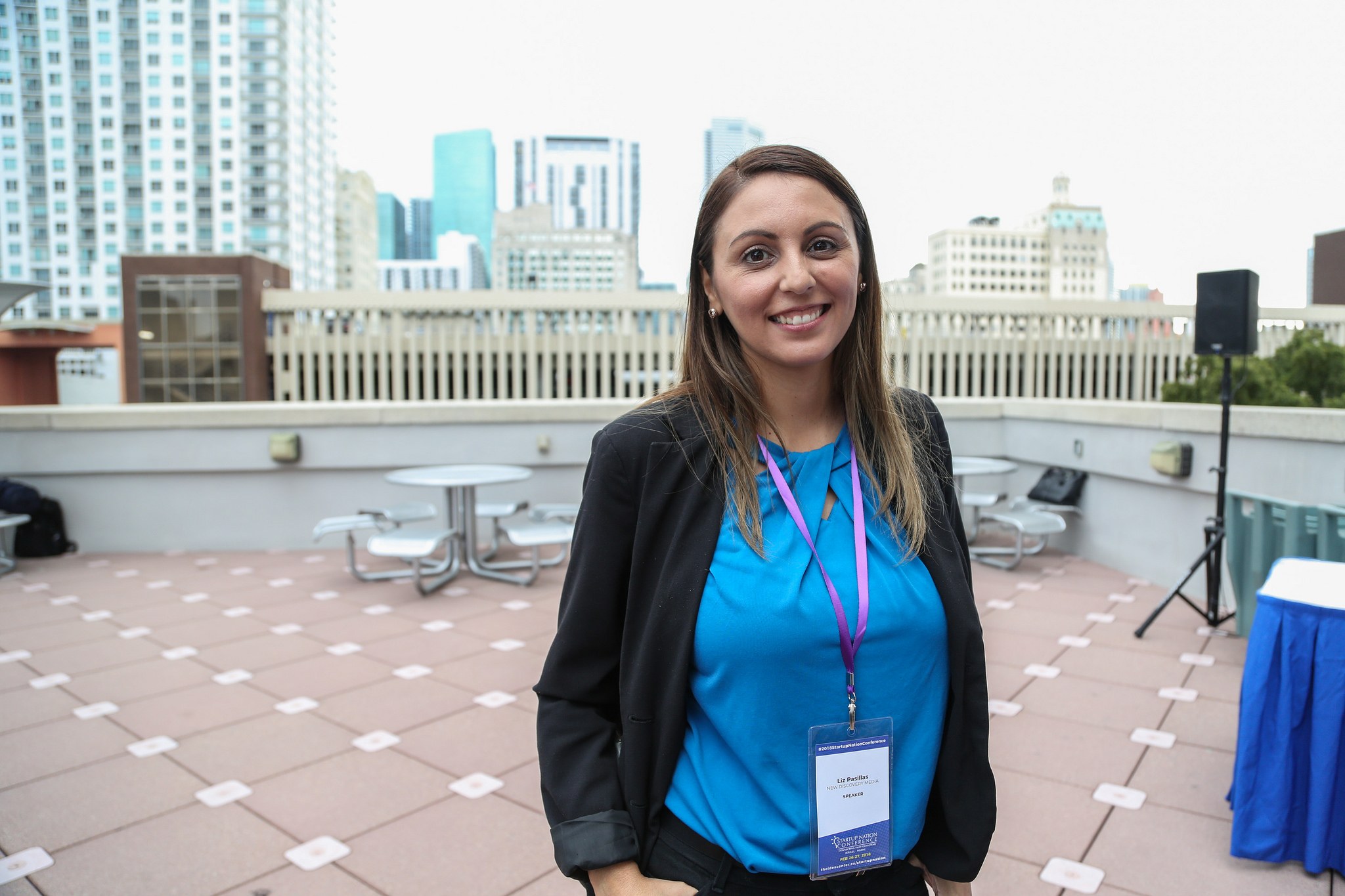 Liz Pasillas with a Startup Nation Conference badge in Miami